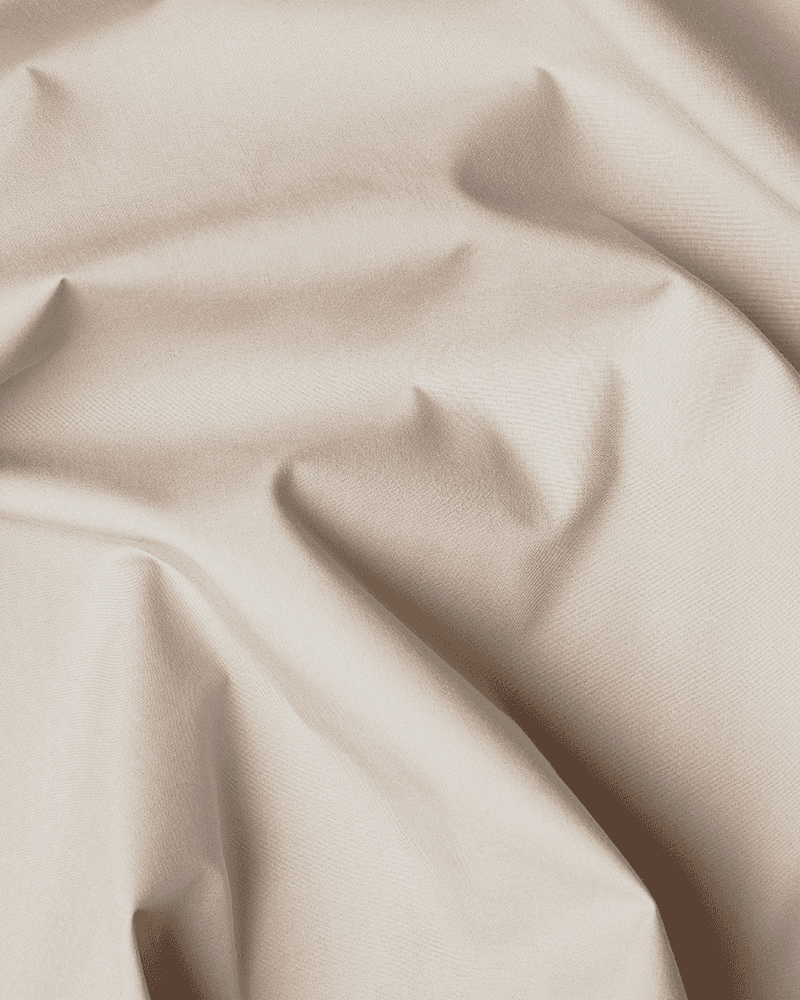 Närbild av den beige OEKO-TEX®-certifierade bomullen till sängkappan